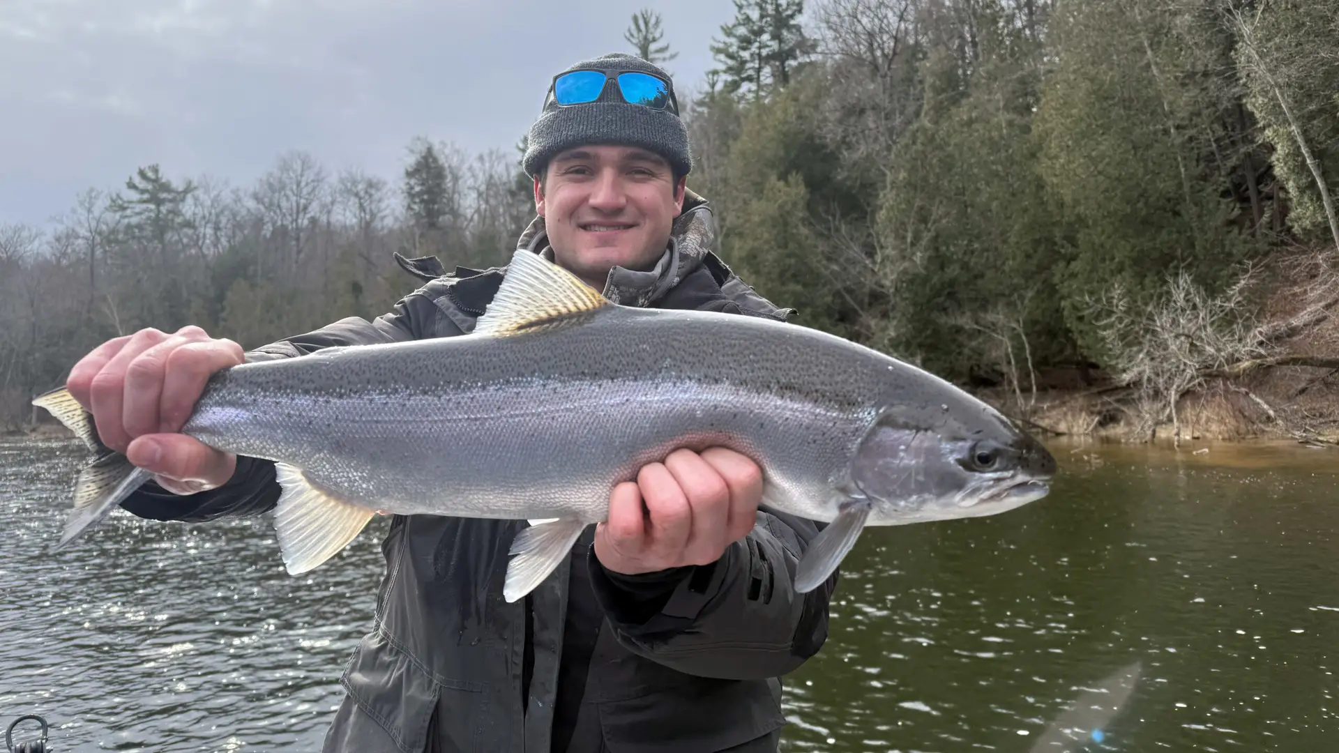 Close up of person holding a steelhead