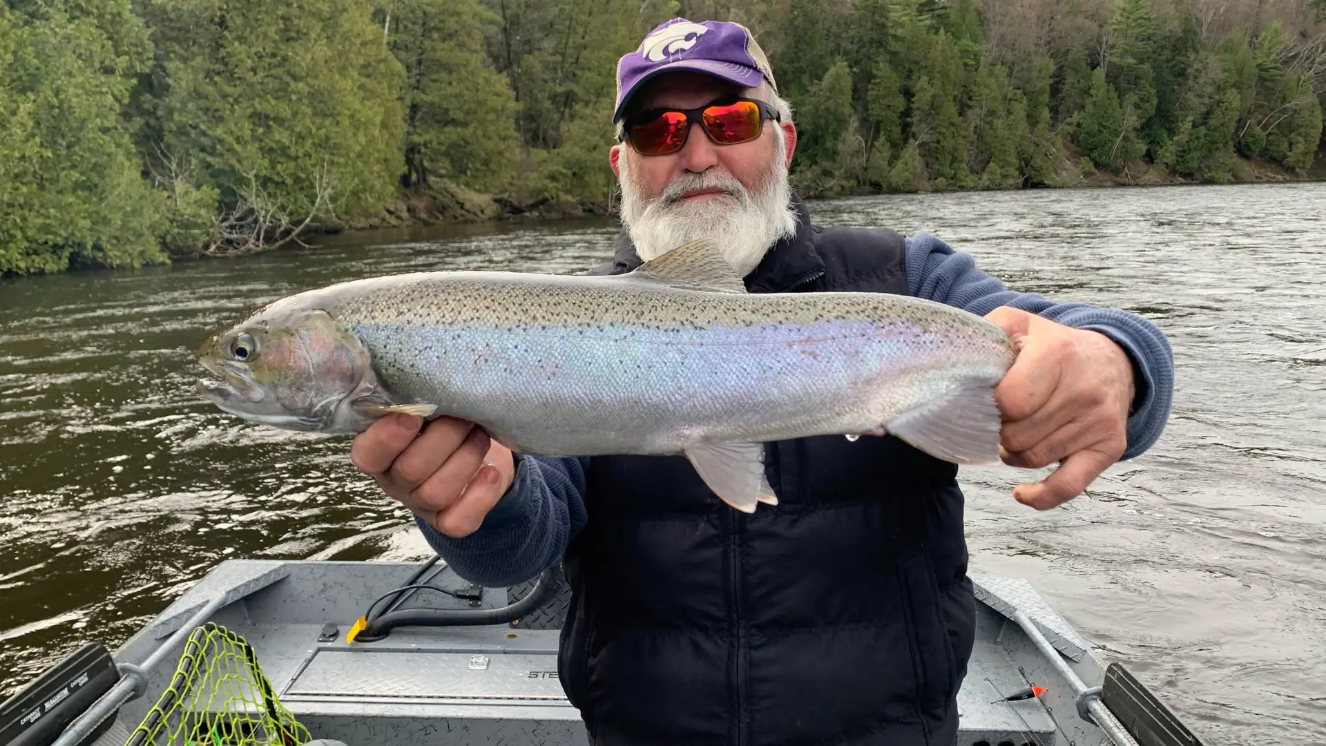 Close up of person holding a steelhead