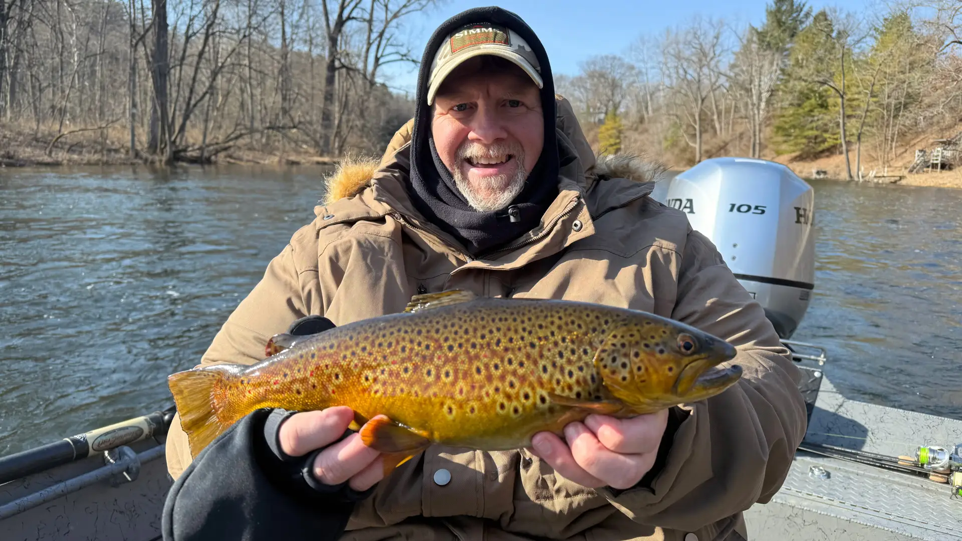 Close up of a person holding a trout